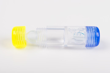 container with lenses for correction of vision on a white background