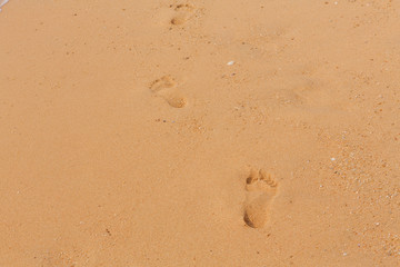 Beach with foot prints on sand