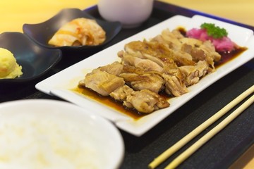 Japanese foods, Teriyaki chicken served with rice, miso soup, Chawanmushi and salad. Close up view..