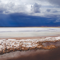 Salt lake in front of a curtain against the dark sky
