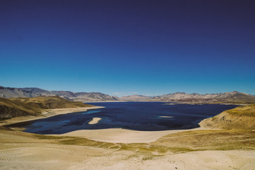 Lake on a background of a dark blue sky