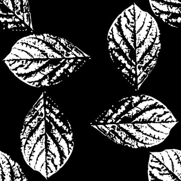 Prints of leaves of trees. Seamless pattern.