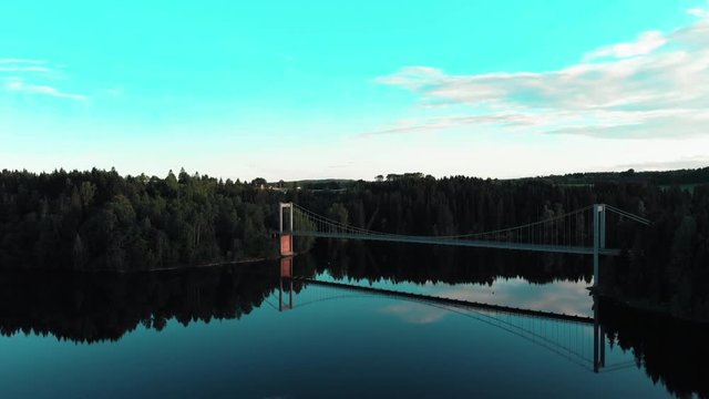Bridge in Glomma at sunset and a calm day reflex in water