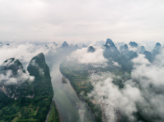 clouds twining round the green mountain