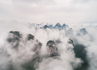 clouds twining round the green mountain