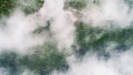 clouds twining round the green mountain
