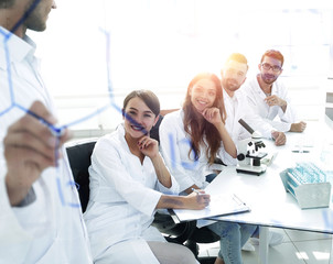 view through the transparent Board. a scientist makes a report.