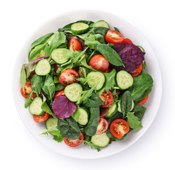 Fresh green salad with tomatoes isolated on white background.