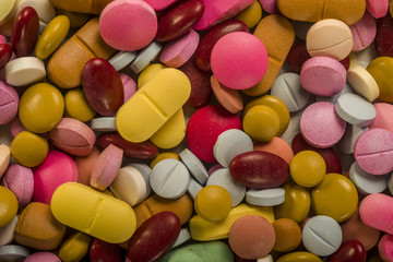 Fototapeta na wymiar Stack of colorful pills 