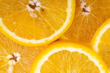 Orange fruit slice. Selective focus and crop fragment
