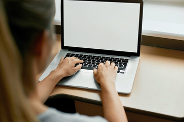 Cropped portrait of female employee typing on keyboard on generic laptop, working on financial...