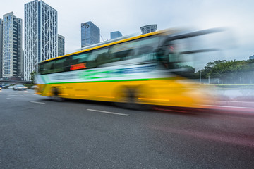 Obraz na płótnie Canvas urban city road with motion bus at twilight, china.