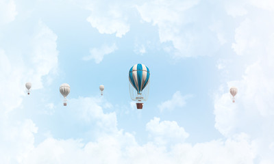 Flying hot air balloons in the air.