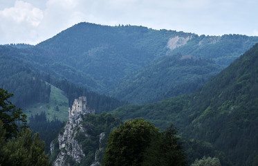 View of a mountain landscape with forest and ruins of Strecno Castle, Slovakia