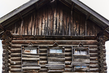 old wooden house with boarded-up