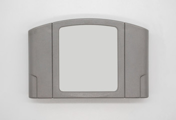 TV game cartridge in grey plastic case from 90s isolated on white