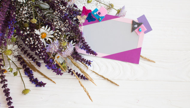 Postcard from paper flowers. Scrapbooking, creative mess. The view from the top.