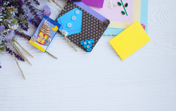 Postcard from paper flowers. Scrapbooking, creative mess. The view from the top.