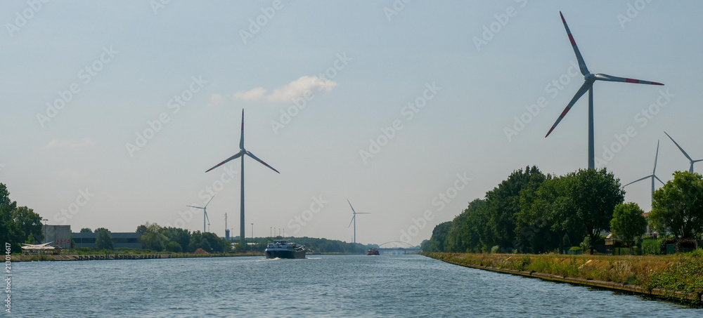 Wall mural wind turbines at canal