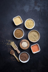 Mixed grains on dark background; overhead view