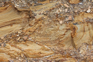 a textured patterned rock cliff face background