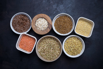 Mixed grains on dark background, overhead view, close up