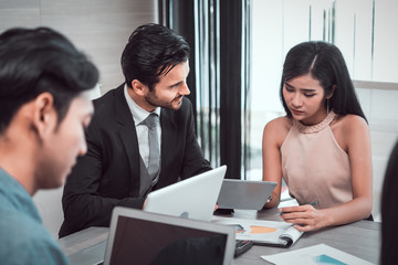 manager discussing work with his colleagues at meeting, business teamwork and partnership concept.  