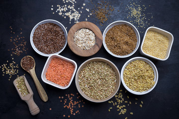 Mixed grains on dark background, overhead view, close up