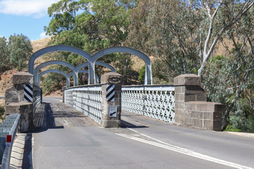 REDESDALE, AUSTRALIA - February 25, 2018: The Redesdale bridge (1867-68), over the Campaspe River is one of the oldest iron lattice-truss bridges in Victoria, Australia