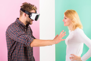 Man VR glasses going touch breasts virtual girl. Cyber relations instead real. Virtual reality pleasures. Virtual sex concept. Guy vr glasses interact in cyber space with girl. Flirt and relations