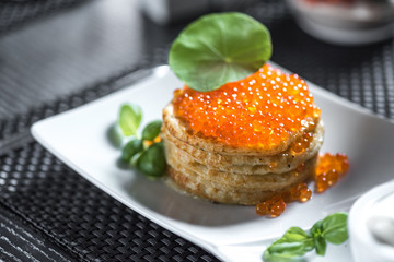 Pancakes with caviar in 