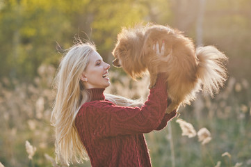 Beautiful happy girl and her friend dwarf Spitz 1398.