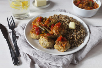 Meatballs with vegetable sauce and buckwheat