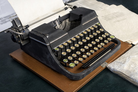 typewriter with Russian font with paper sheet.