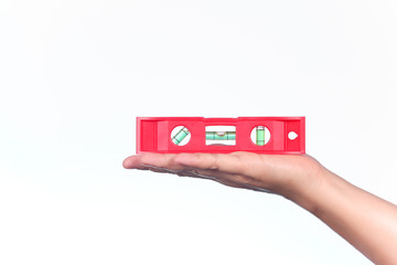 Water level meter in the hand on white background.