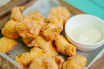 Fried crispy chicken nuggets with sauce