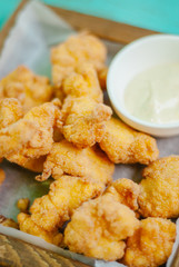 Fried crispy chicken nuggets with sauce