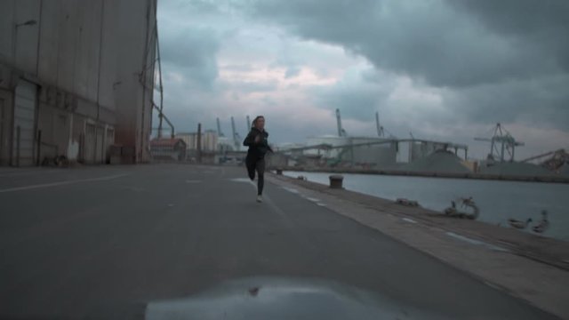 Girl sprinting on Harbor.