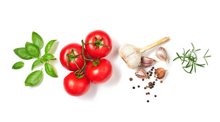 Ripe red tomatoes with basil, rosemary, garlic and pepper isolated on white background. Top view.