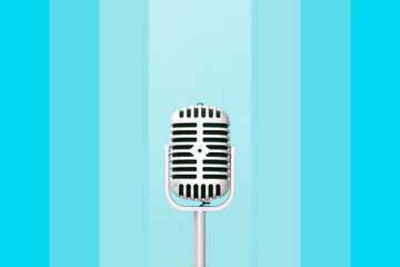 Retro microphone on gradient blue color wall background