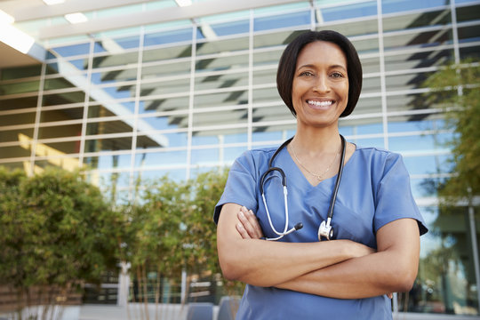 Smiling Mixed Race Female Healthcare Worker Outside Hospital