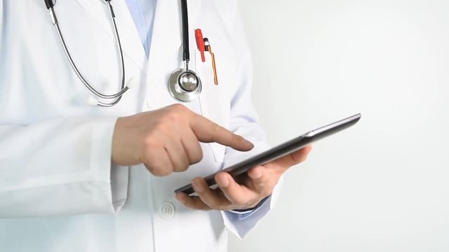 Doctor Using Tablet