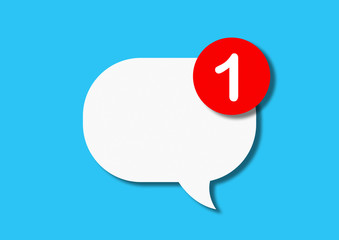 White paper cartonboard speech bubble with a red circle with a message about a single message on a blue background. The concept of notification on the phone or social networks. Flat lay, top view