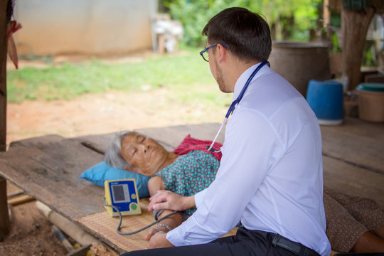 Doctor Or Medical Volunteers To Visit Elderly People In Rural Asia.