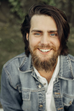  A Large-sized Portrait Of A Bearded Dark-haired Guy In A Blue Jeans Similar To Jared Leto