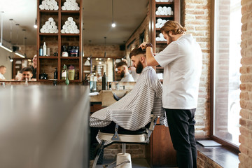 Barber Shop. Man Getting Haircut In Hair Salon