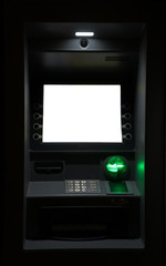 ATM machine at night. Blank white screen for text.