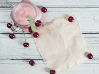 Cherry smoothie with cherries and ice cream and place for inscription