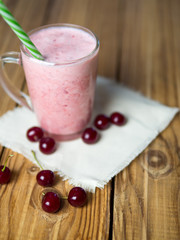 Cherry smoothie on wooden rustic table