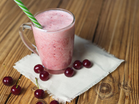 Cherry smoothie on wooden rustic table